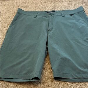 Travis Mathew Gold shorts size 34